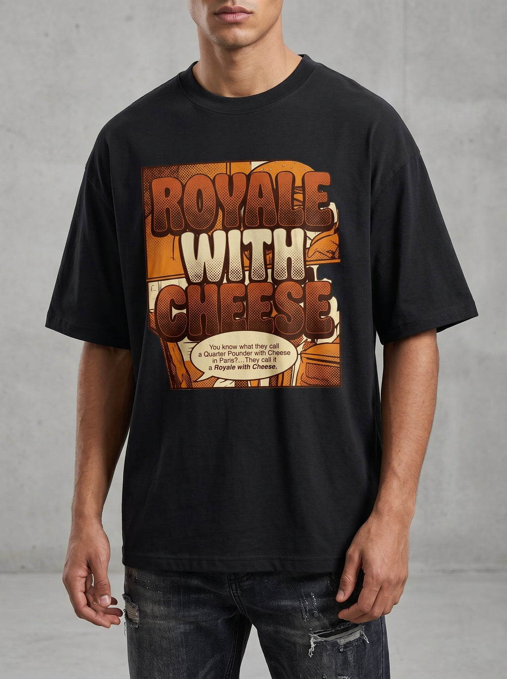 Male model wearing Culture Canvas Pulp Fiction tribute oversized tshirt — bold pop-art comic graphic in amber on jet black, unisex boxy fit