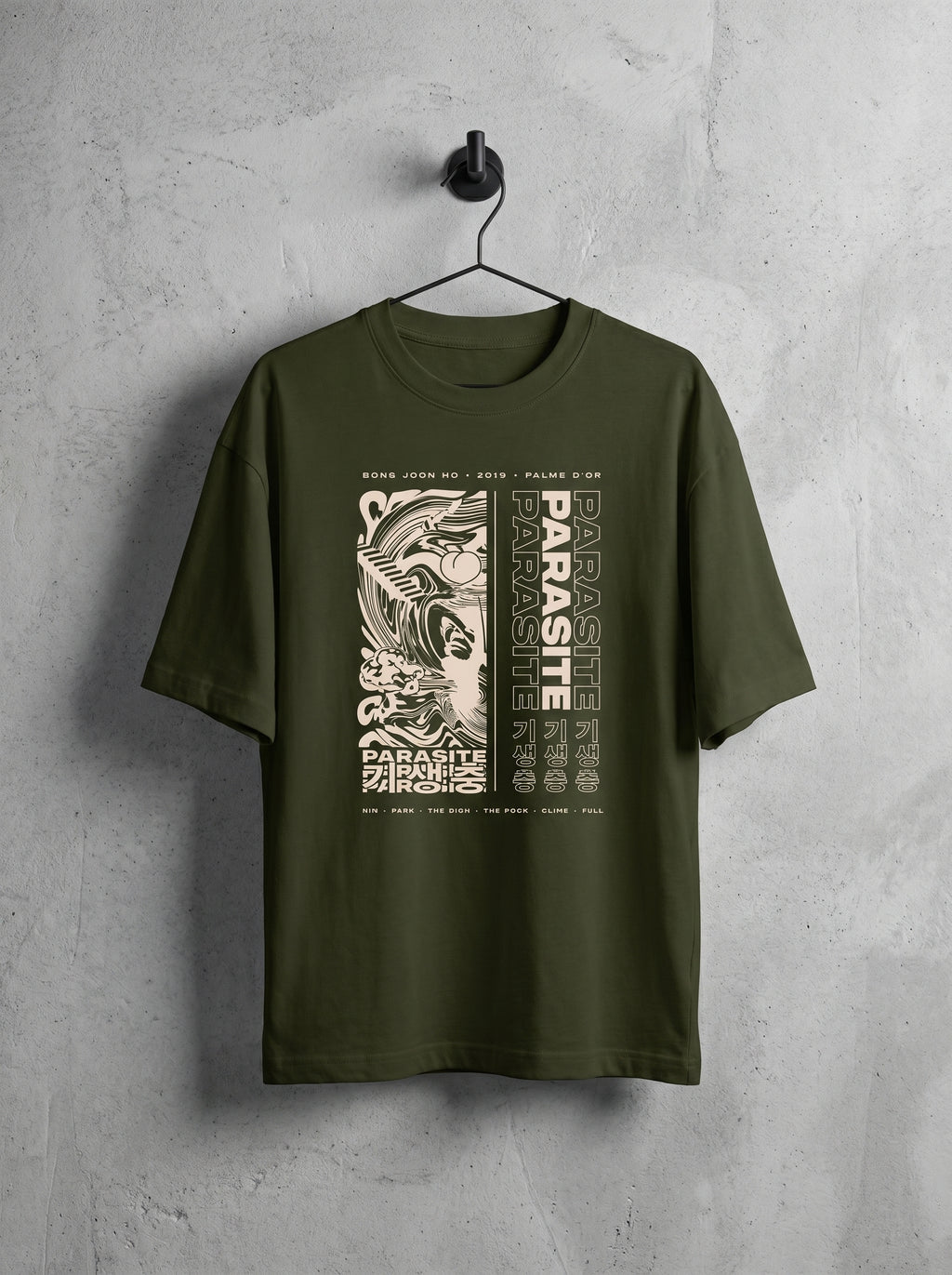 Bold acid-collage screen print inspired by Parasite 2019 — Korean typography and poster art on olive green oversized tee